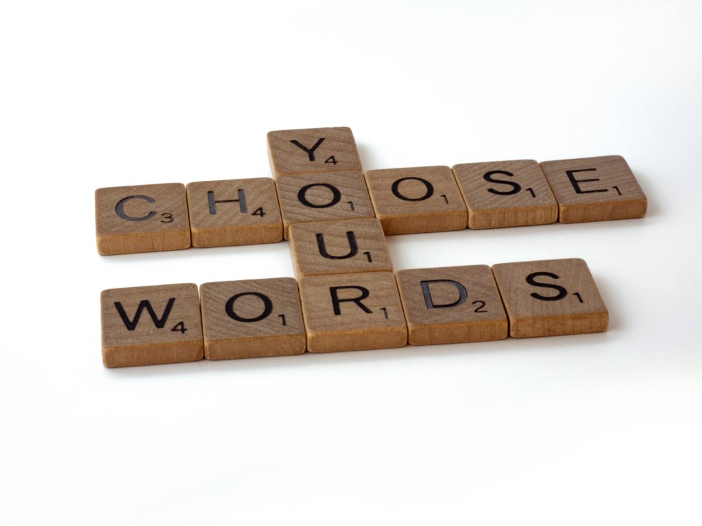 scrabble pieces spelling choose your words