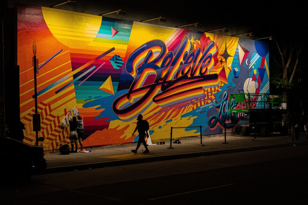 colorful mural with believe spelled out